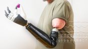 How Mind-Controlled Bionic Arms Fuse To The Body