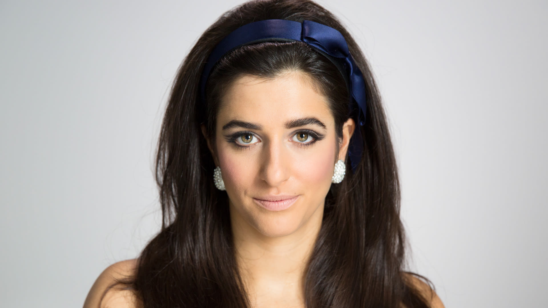 Watch How to Recreate a 1960s Hairstyle for Your Holiday Party Allure
