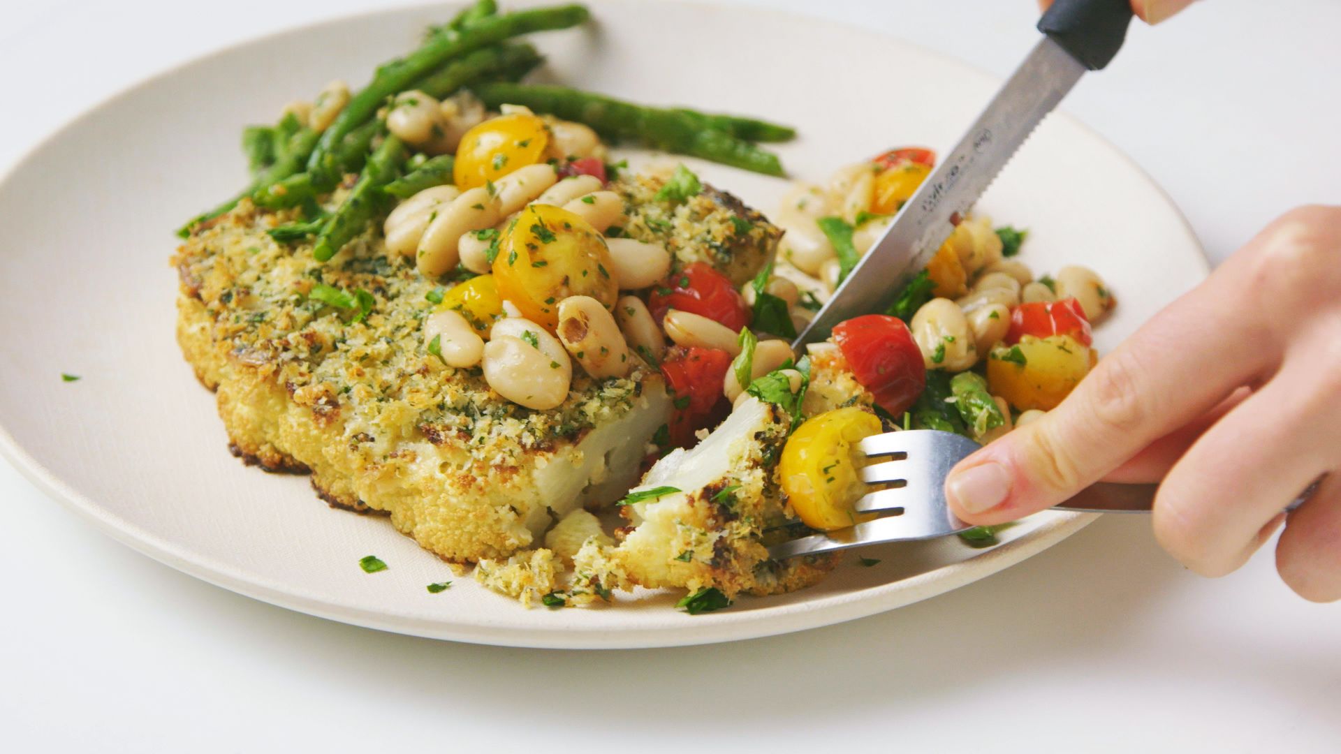 Watch HerbCrusted Cauliflower Steaks with Beans and Tomatoes Epicurious