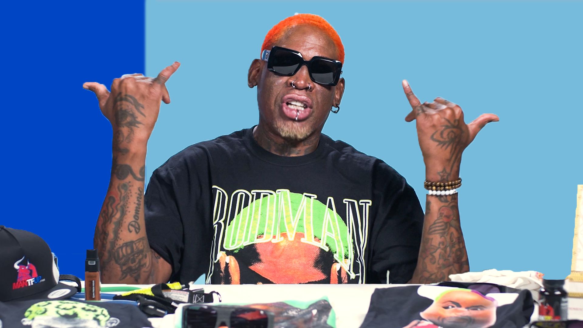 Dennis Rodman, 60, wears unmissable flamingo jersey to host