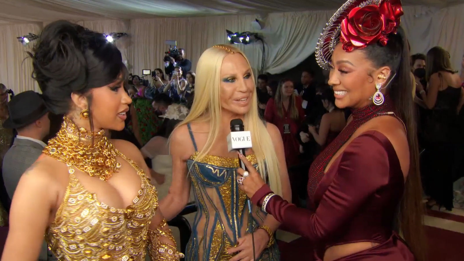 Watch Cardi B Donatella Versace on Cardi s Golden Metal Dress Met Gala Vogue