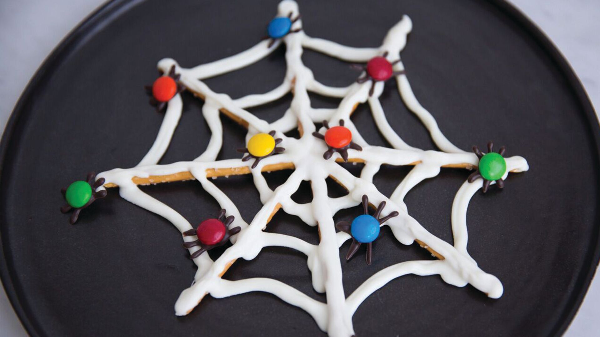 Watch How to Make a Chocolate and Pretzel Spiderweb for Halloween